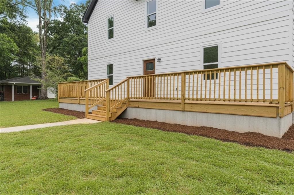 331 Highway 162 Covington, GA 30016 - Photo 2 of 26 a view of a house with a yard and deck