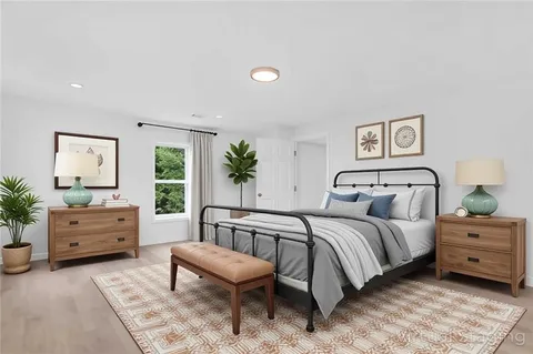 a bedroom with a bed and furniture