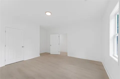 a view of an empty room and a window