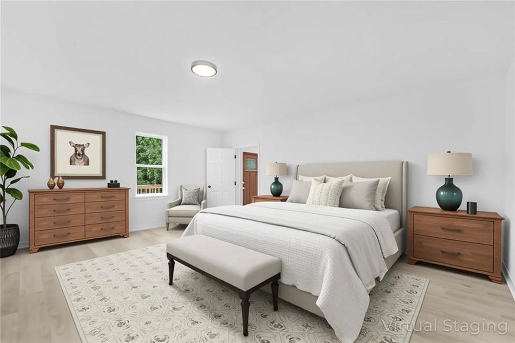 331 Highway 162 Covington, GA 30016 - Photo 7 of 26 a bedroom with a large bed and a dresser