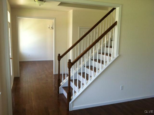 4110 Walter Road Bethlehem, PA 18020 - Photo 4 of 6 a view of staircase with wooden floor and white walls