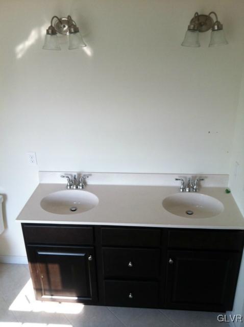 4110 Walter Road Bethlehem, PA 18020 - Photo 6 of 6 a bathroom with a sink and a mirror