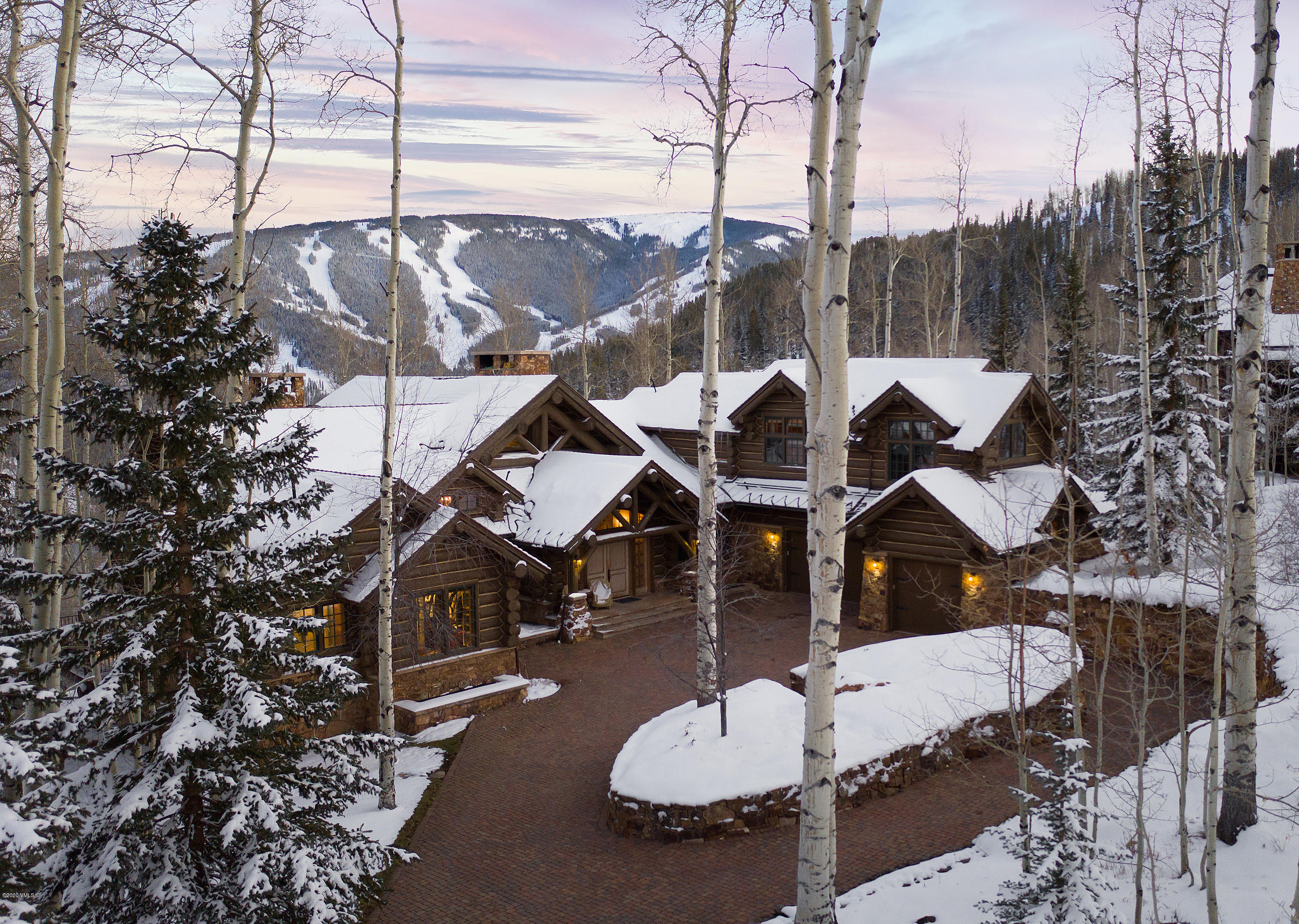 3389 Daybreak Ridge Road Avon, CO 81620 - Photo 24 of 24 an aerial view of a house with swimming pool and outdoor seating