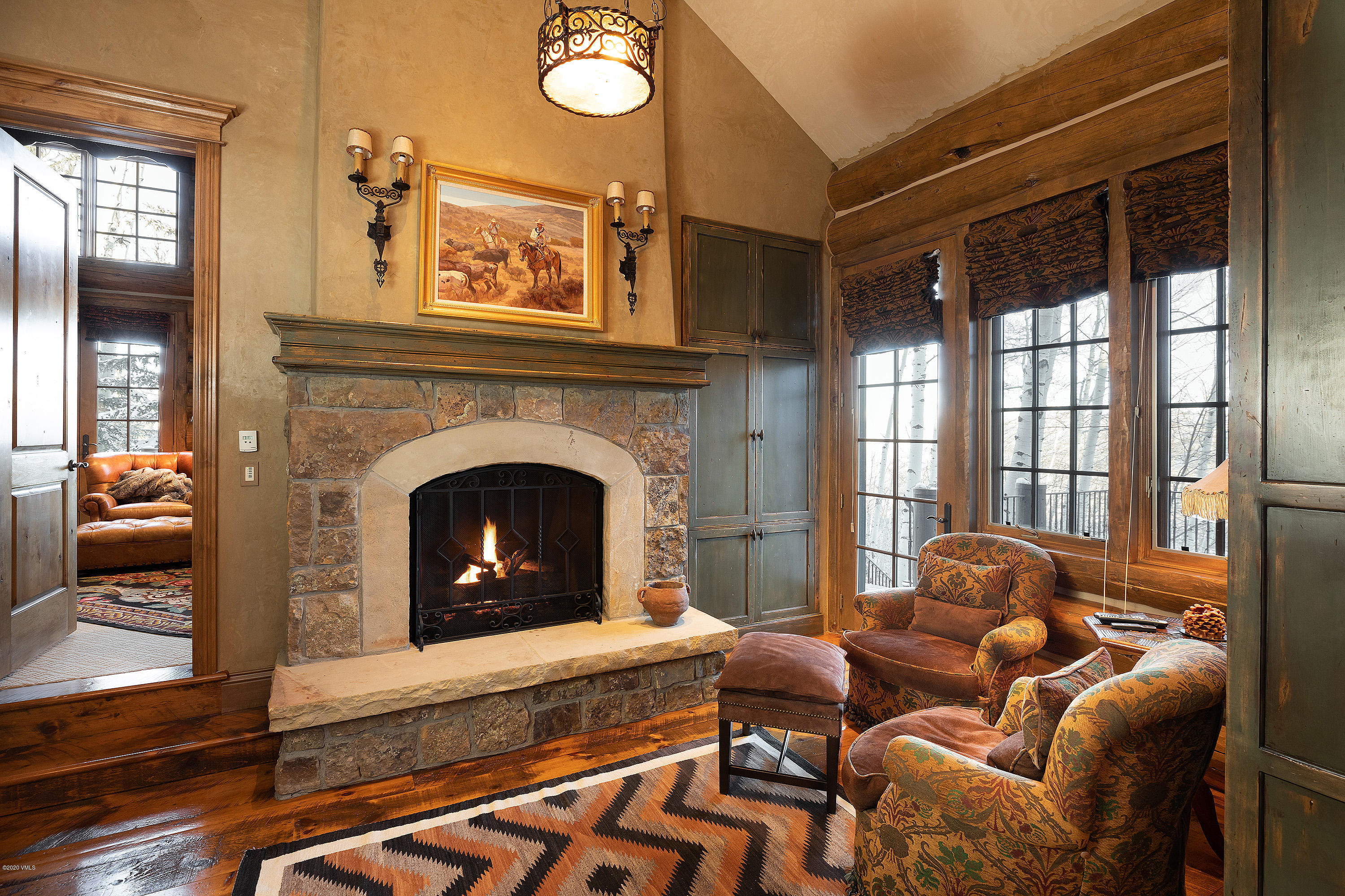 3389 Daybreak Ridge Road Avon, CO 81620 - Photo 9 of 24 a living room with furniture and a fireplace