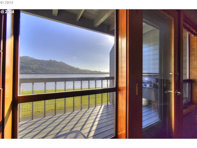 a view of balcony with wooden floor