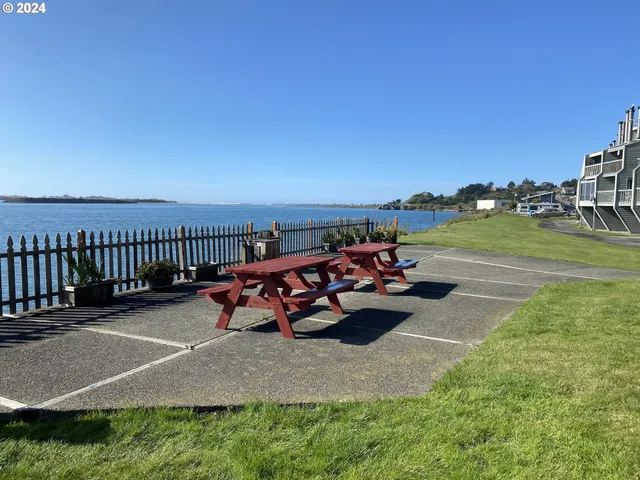 a view of a patio with table and chairs