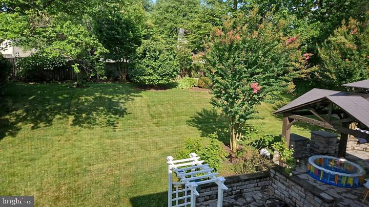 17404 Hughes Road Poolesville, MD 20837 - Photo 10 of 15 Lush green oasis in a serene backyard.