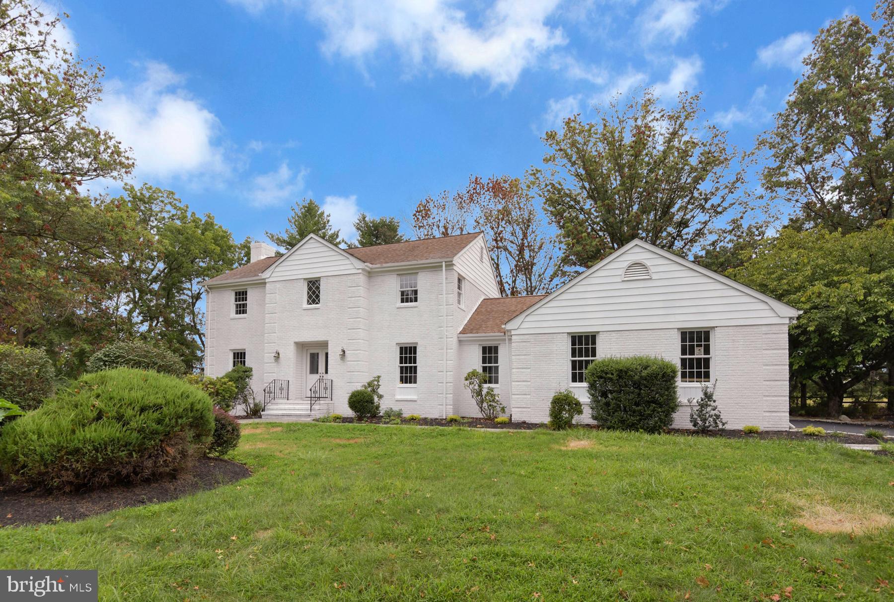 71 Carter Road Lawrence Township, NJ 08648 - Photo 2 of 33 a view of a white house with a yard