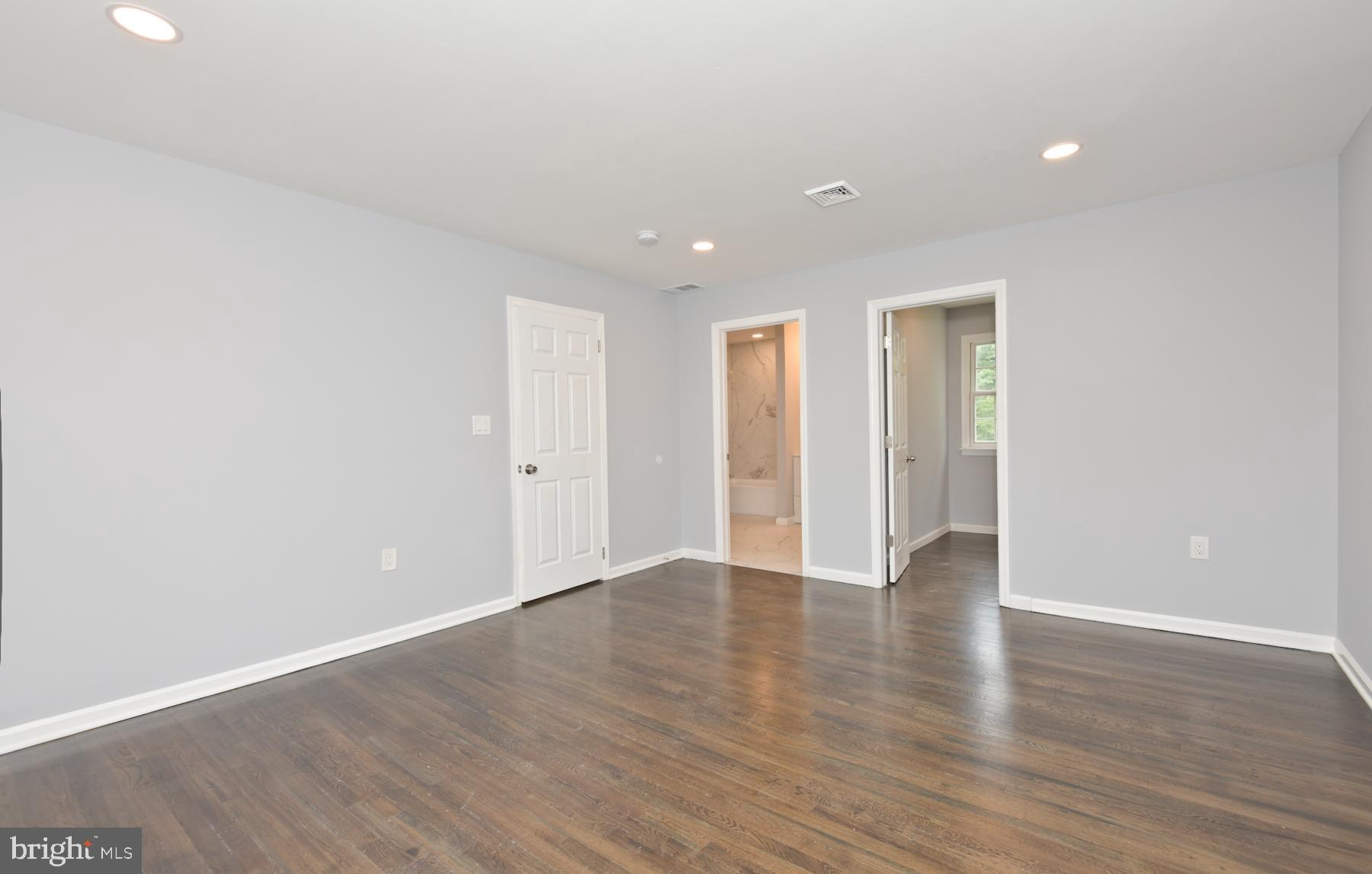 71 Carter Road Lawrence Township, NJ 08648 - Photo 20 of 33 a view of an empty room with wooden floor