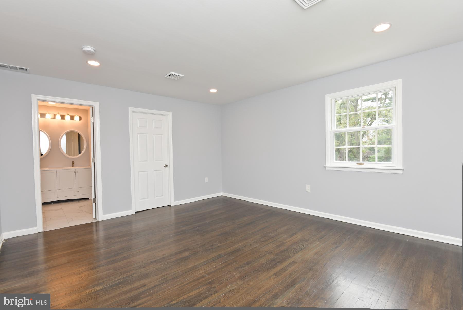 71 Carter Road Lawrence Township, NJ 08648 - Photo 21 of 33 an empty room with wooden floor and windows