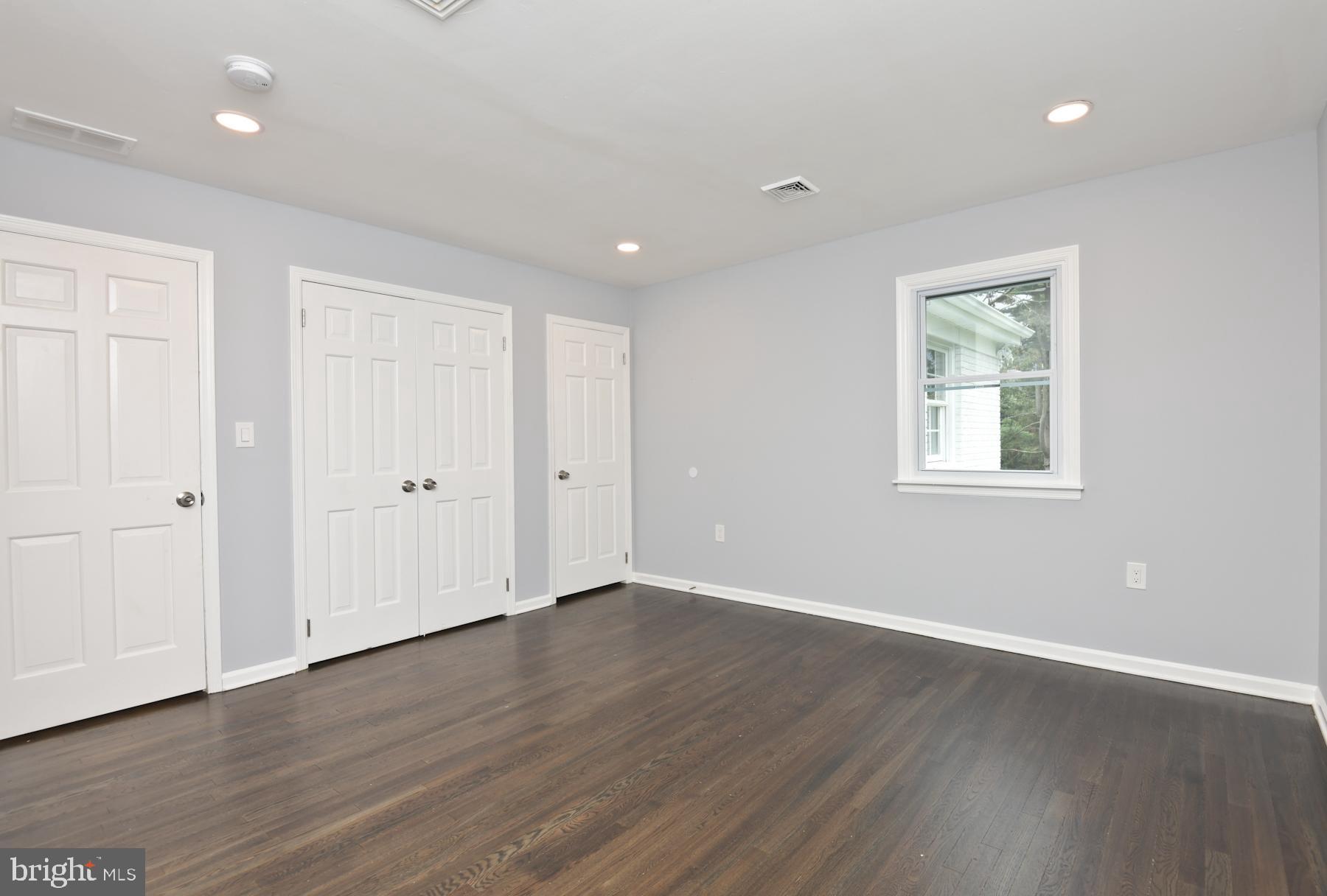 71 Carter Road Lawrence Township, NJ 08648 - Photo 23 of 33 a view of an empty room with wooden floor and a window