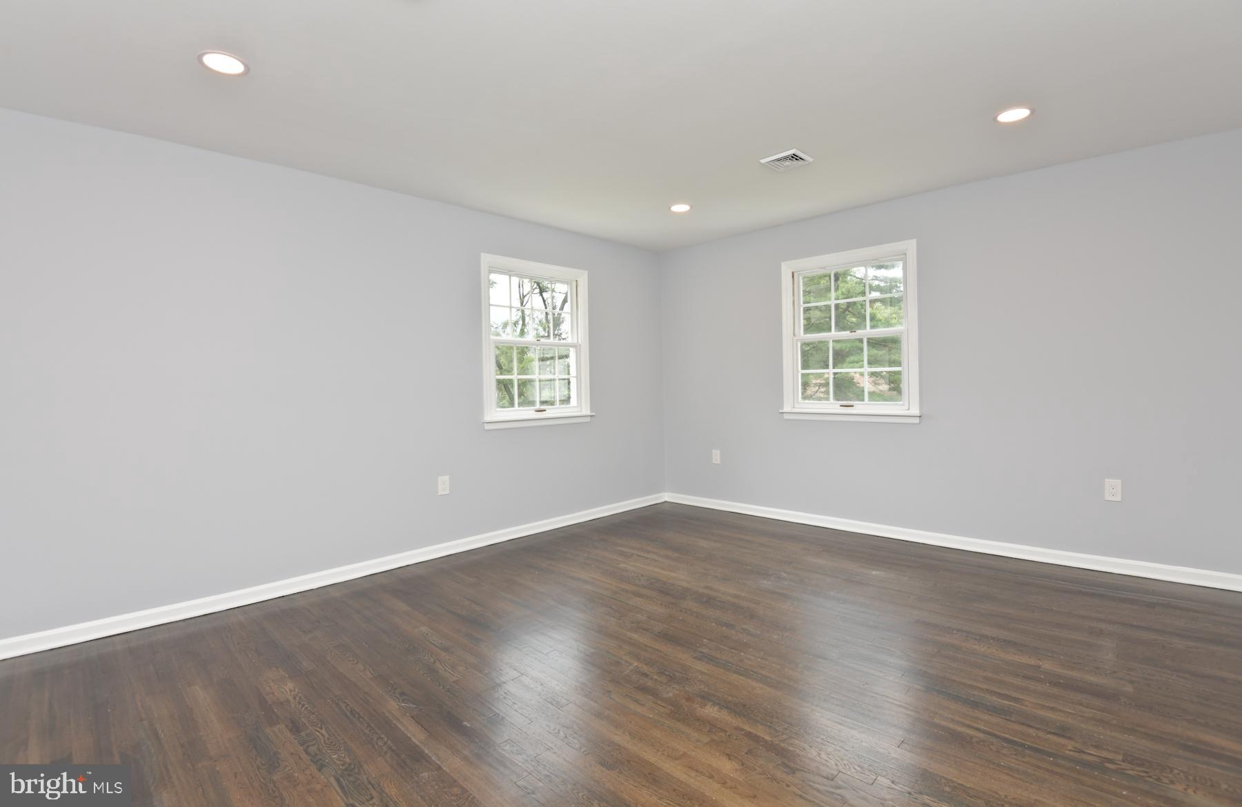 71 Carter Road Lawrence Township, NJ 08648 - Photo 24 of 33 an empty room with wooden floor and windows