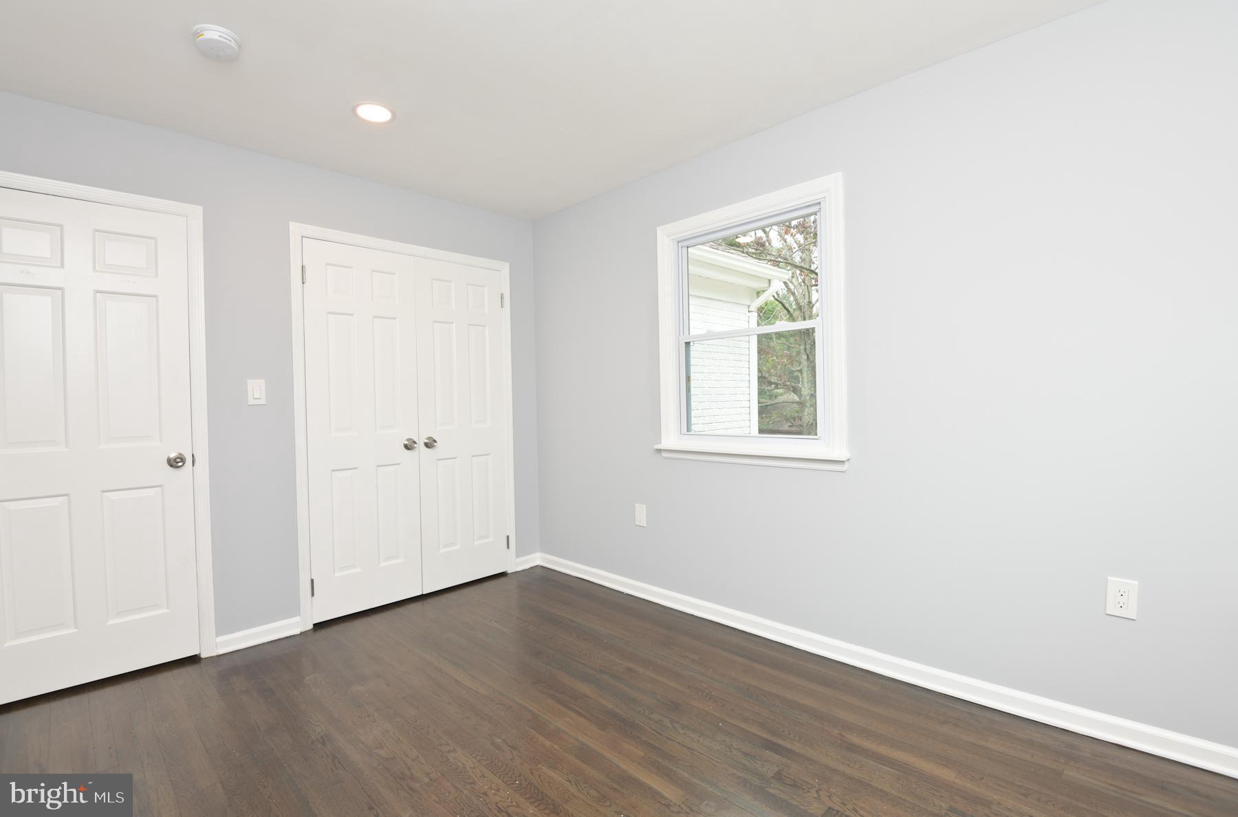 71 Carter Road Lawrence Township, NJ 08648 - Photo 25 of 33 an empty room with wooden floor and windows