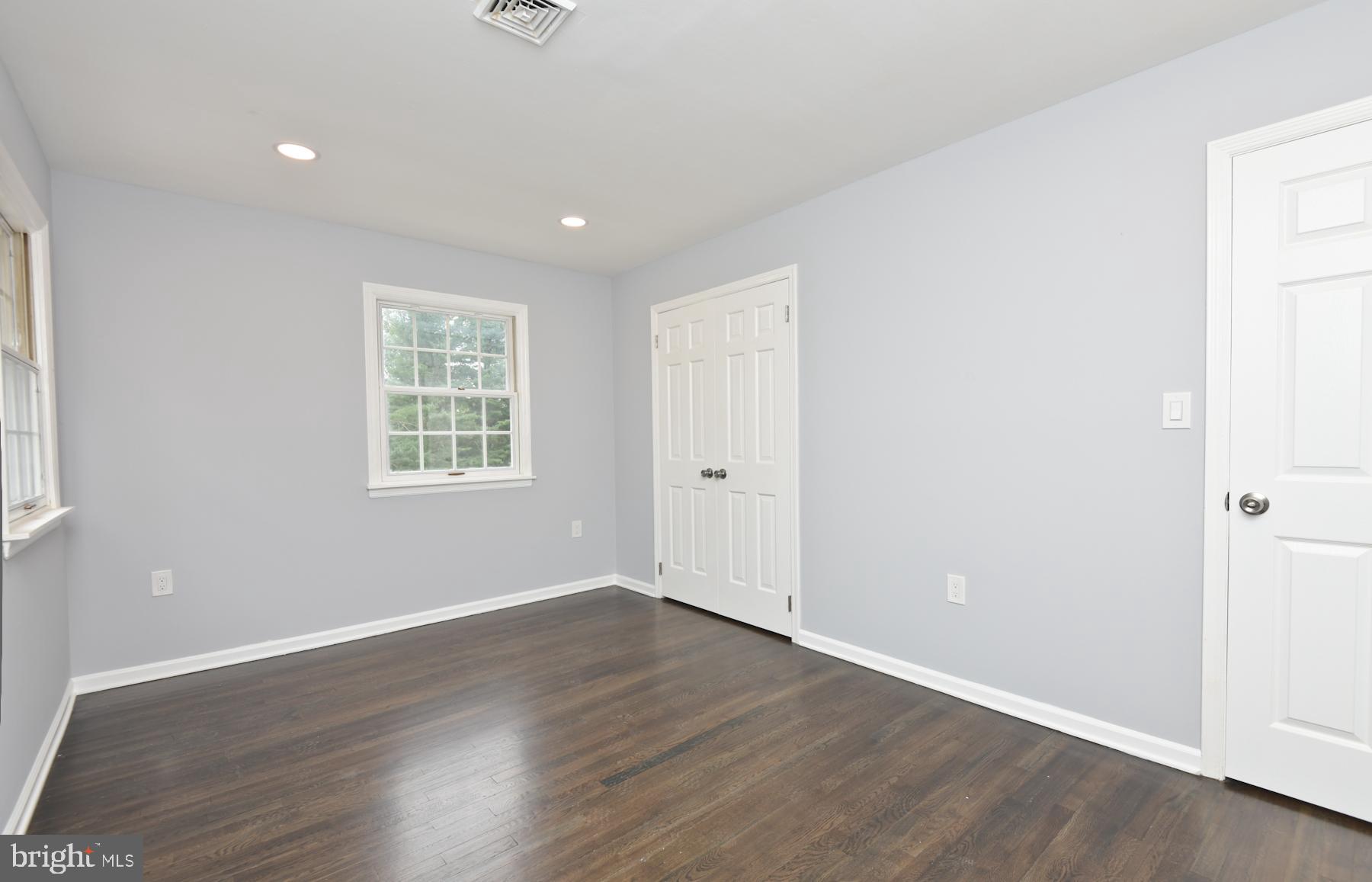 71 Carter Road Lawrence Township, NJ 08648 - Photo 26 of 33 an empty room with wooden floor and windows