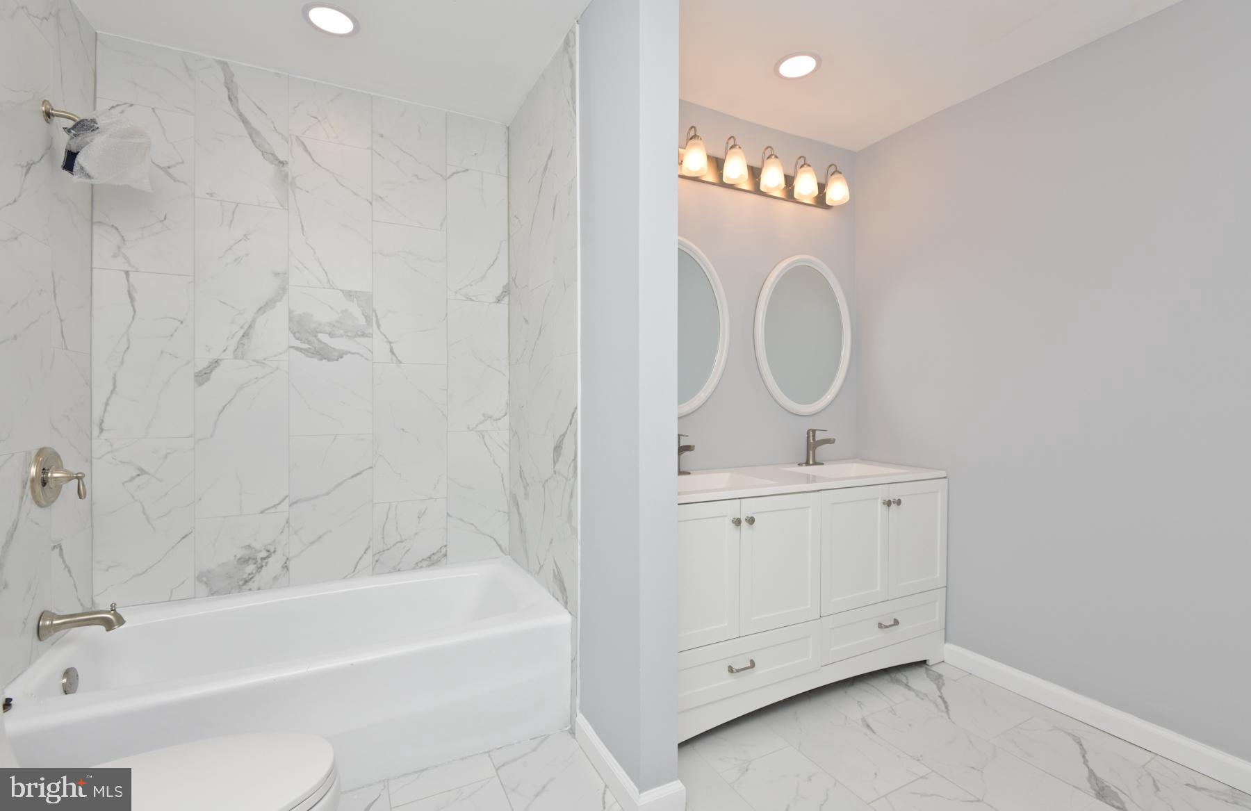 71 Carter Road Lawrence Township, NJ 08648 - Photo 27 of 33 a bathroom with a sink a toilet and bathtub
