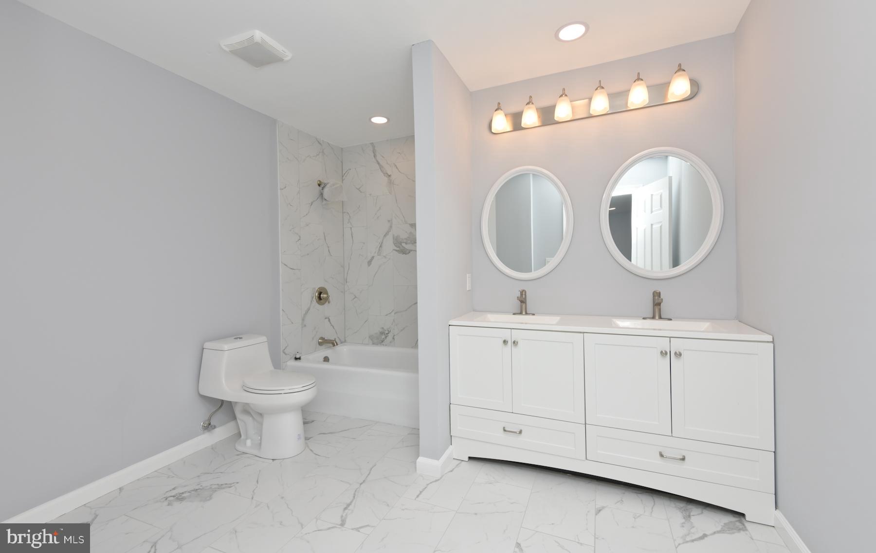 71 Carter Road Lawrence Township, NJ 08648 - Photo 28 of 33 a bathroom with a toilet sink and mirror