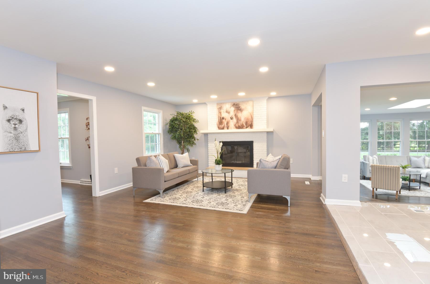 71 Carter Road Lawrence Township, NJ 08648 - Photo 6 of 33 a living room with furniture a fireplace and a table