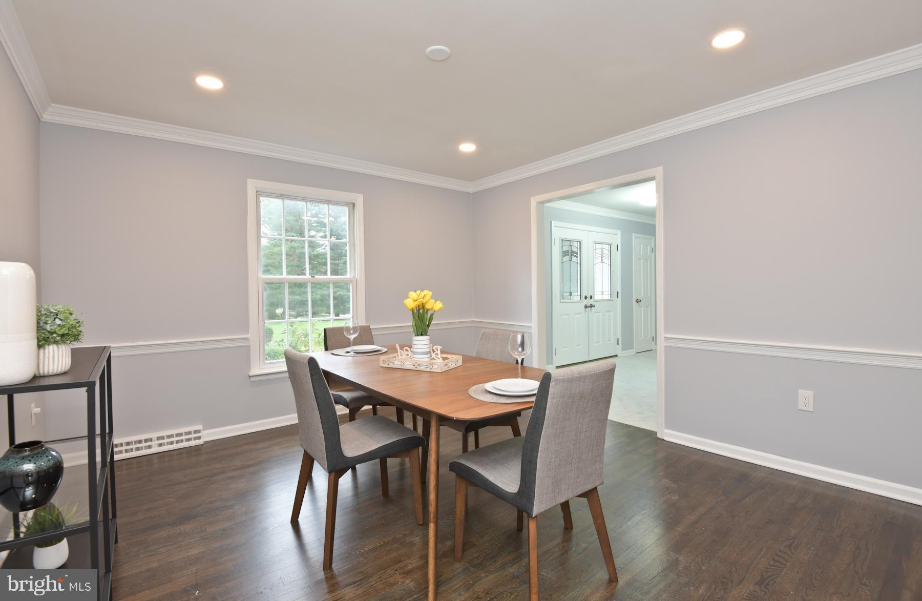 71 Carter Road Lawrence Township, NJ 08648 - Photo 10 of 33 a view of a dining room with furniture and wooden floor