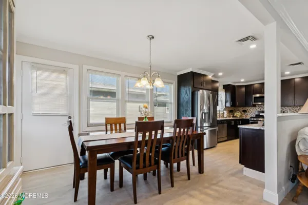 a view of a livingroom with furniture window and wooden floor