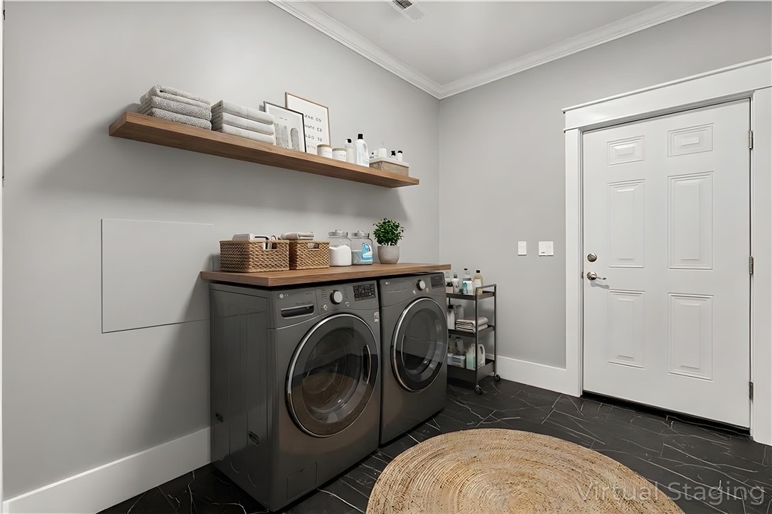 303 Regency Circle Anderson, SC 29625 - Photo 40 of 50 This functional laundry room features modern appliances and elegant crown molding.