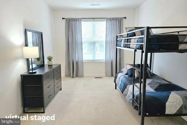 a bed room with a bed and a television