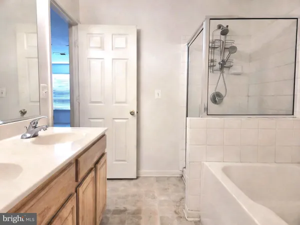 a bathroom with a bathtub and a sink