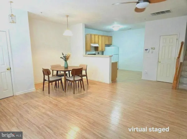 a dining room with furniture and window
