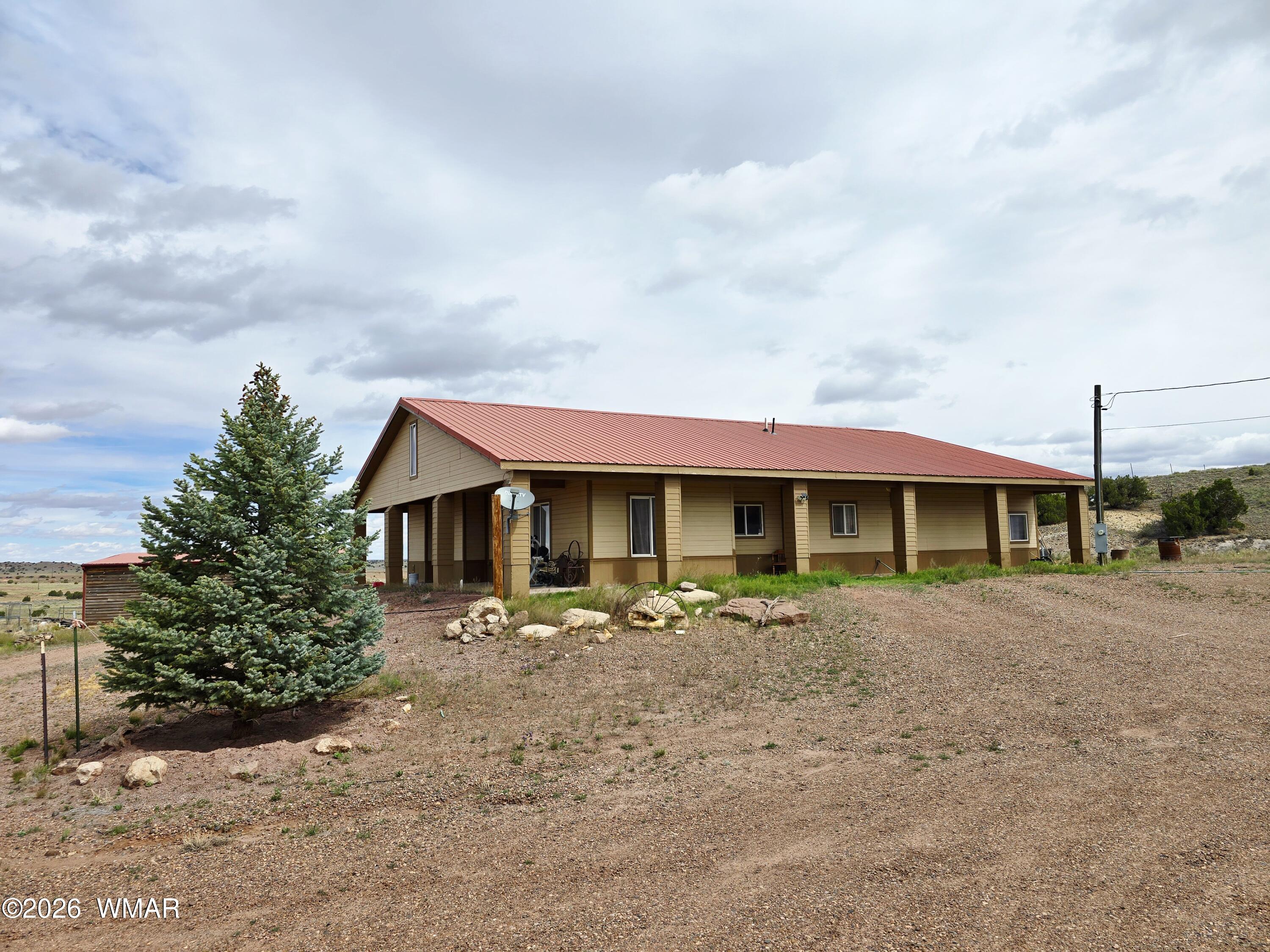 9046 Miller Trail Snowflake, AZ 85937 - Photo 1 of 34 a front view of a house with garden