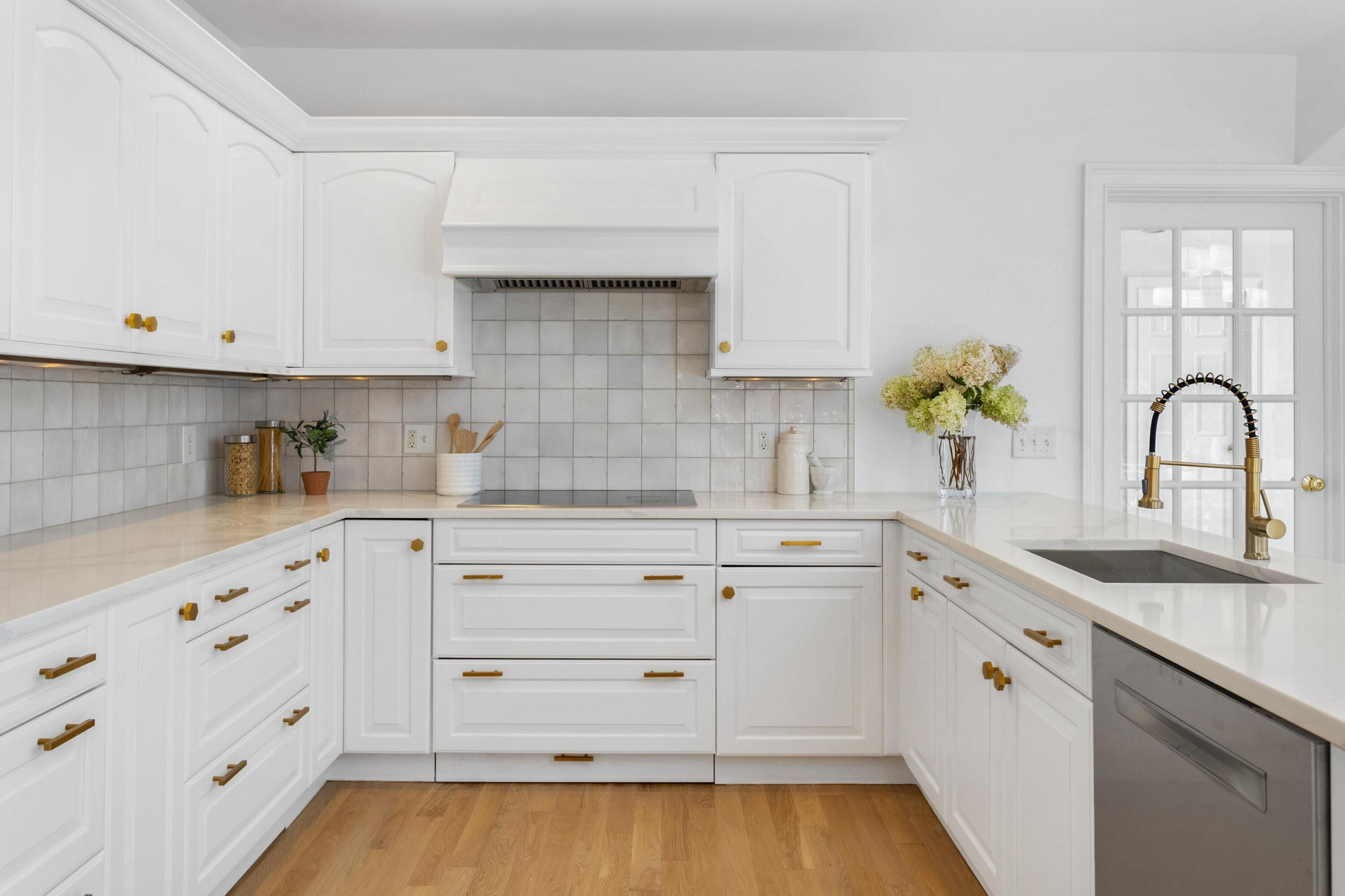 215 Leroy Avenue Darien, CT 06820 - Photo 12 of 34 a kitchen with granite countertop white cabinets and white appliances