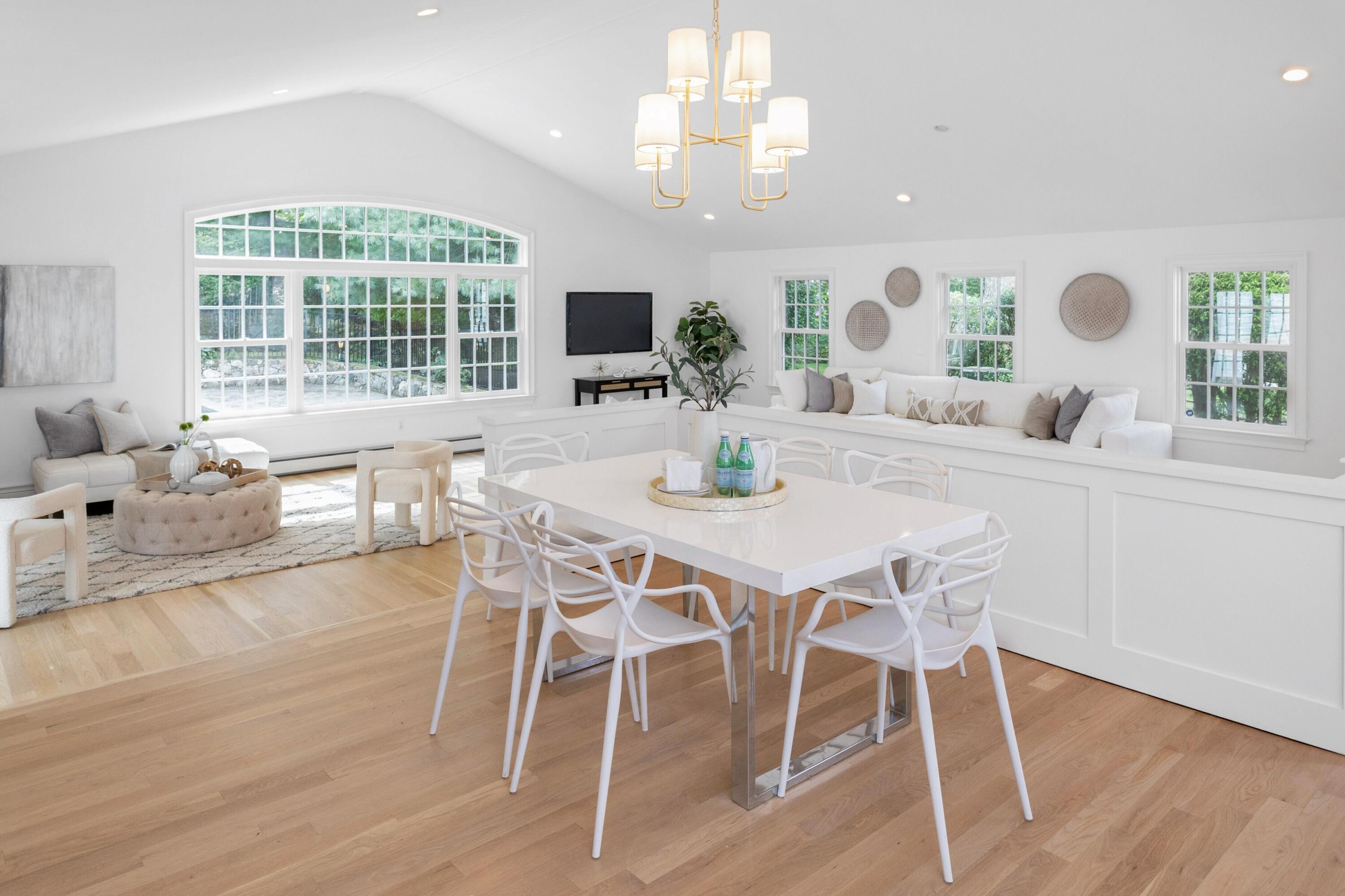 215 Leroy Avenue Darien, CT 06820 - Photo 15 of 34 a view of a dining room with furniture window and wooden floor