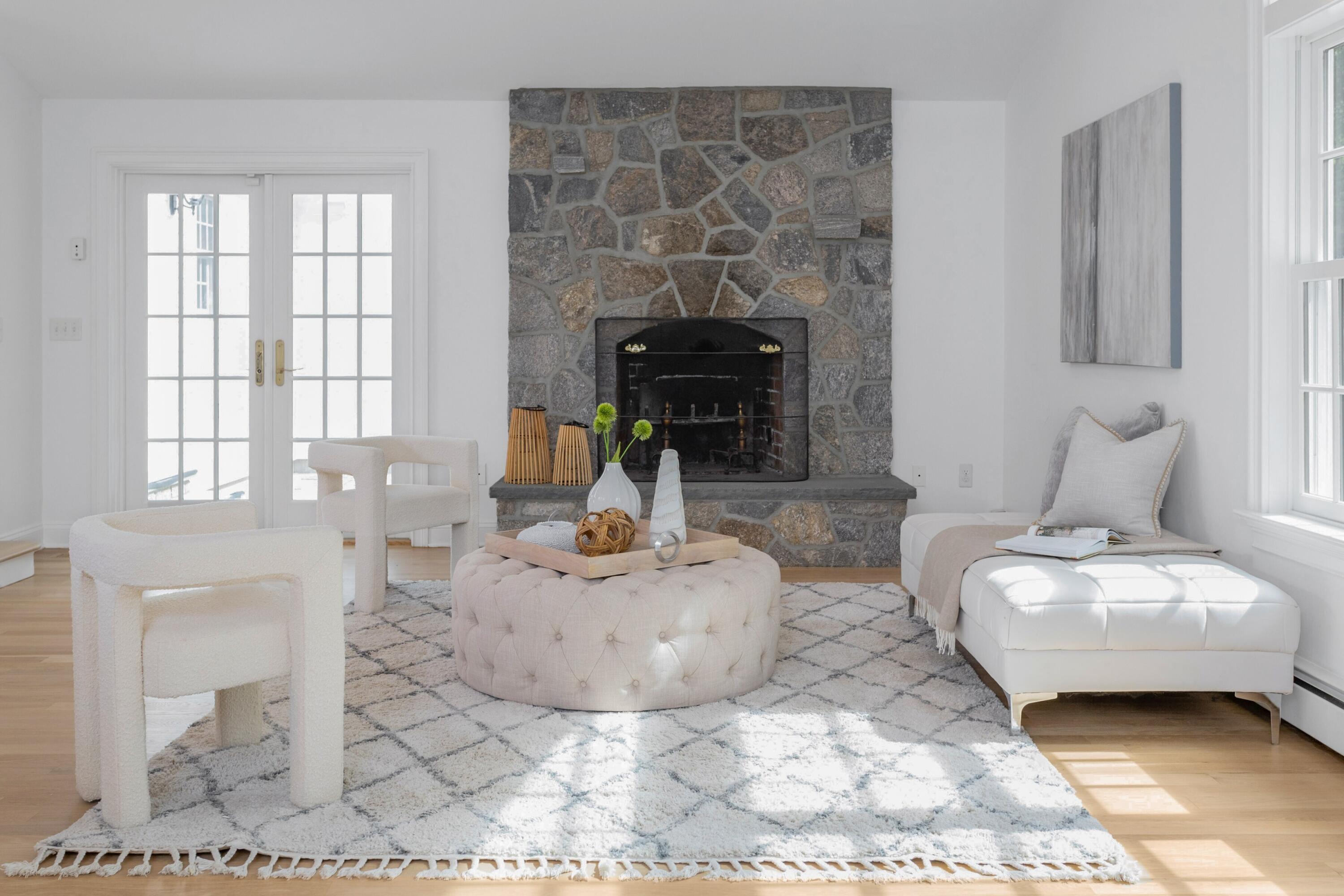 215 Leroy Avenue Darien, CT 06820 - Photo 16 of 34 a living room with furniture and a fireplace