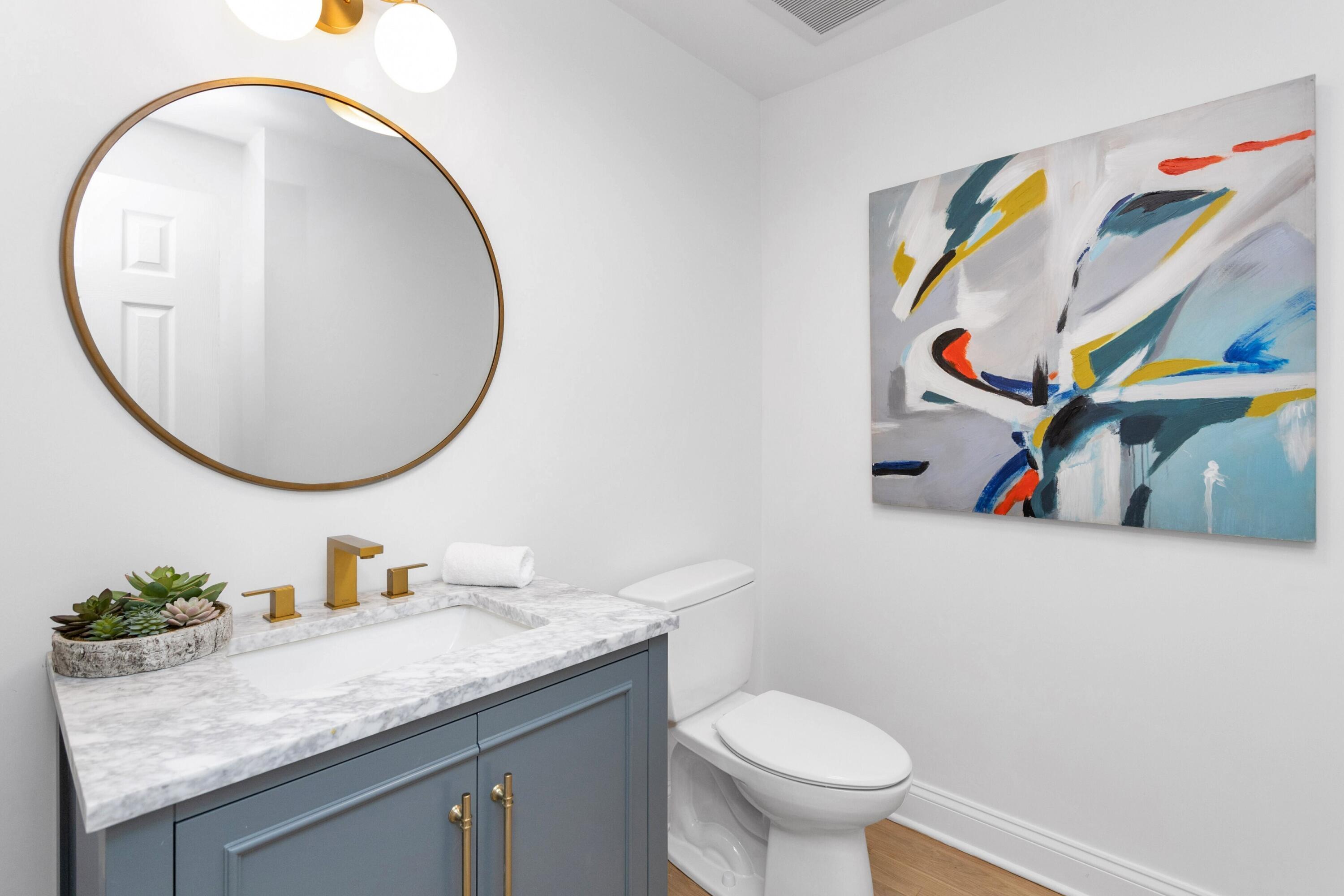 215 Leroy Avenue Darien, CT 06820 - Photo 22 of 34 a bathroom with a granite countertop toilet and a sink