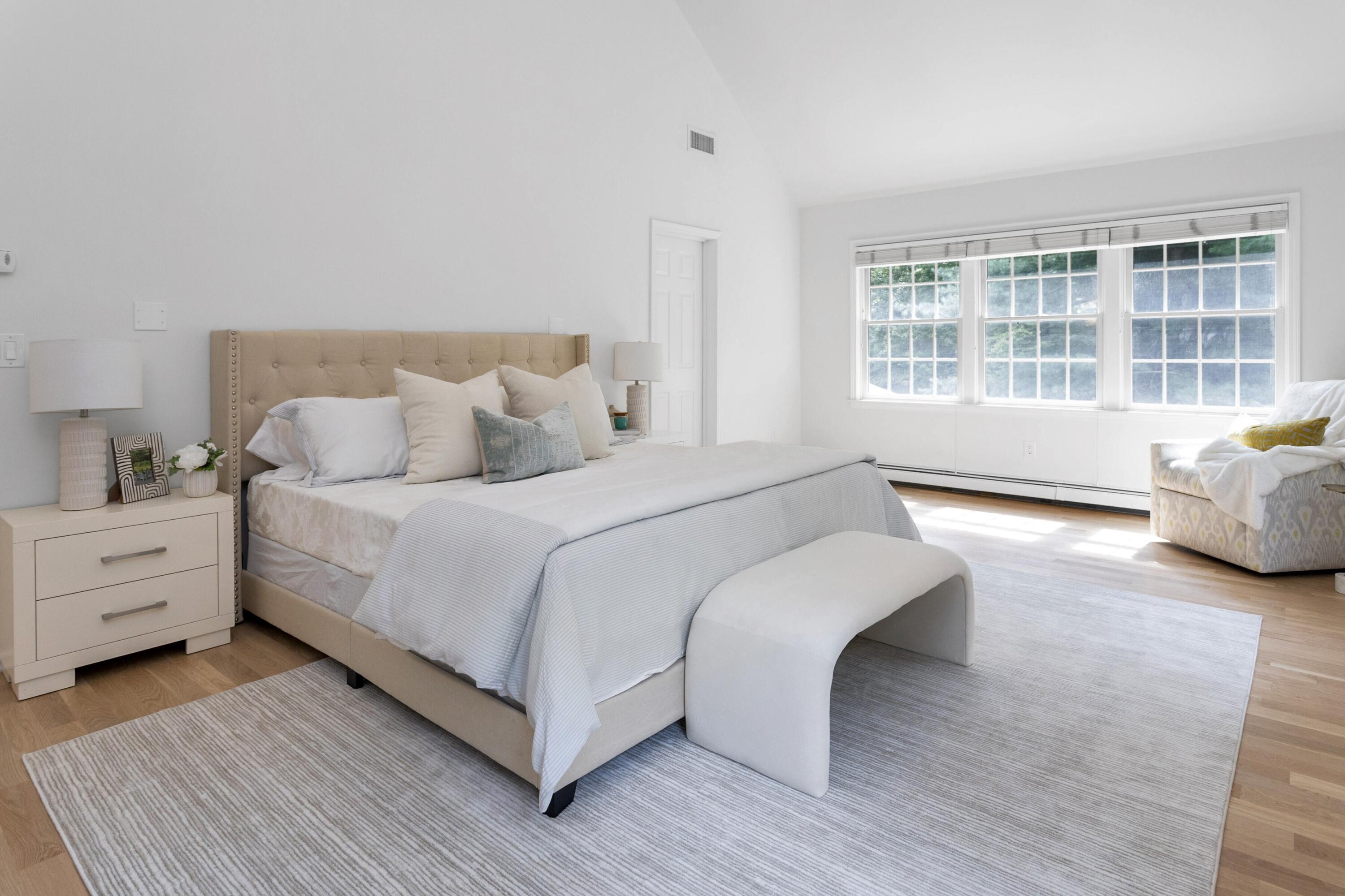 215 Leroy Avenue Darien, CT 06820 - Photo 24 of 34 a spacious bedroom with a bed and a large window