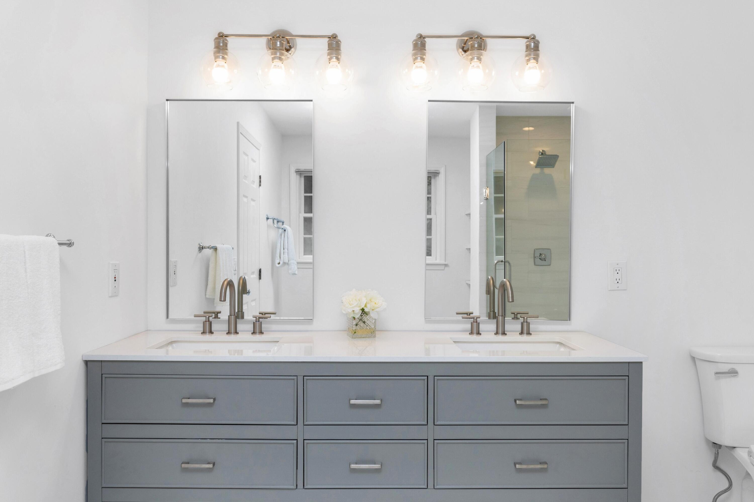 215 Leroy Avenue Darien, CT 06820 - Photo 25 of 34 a bathroom with double vanity sink and a mirror