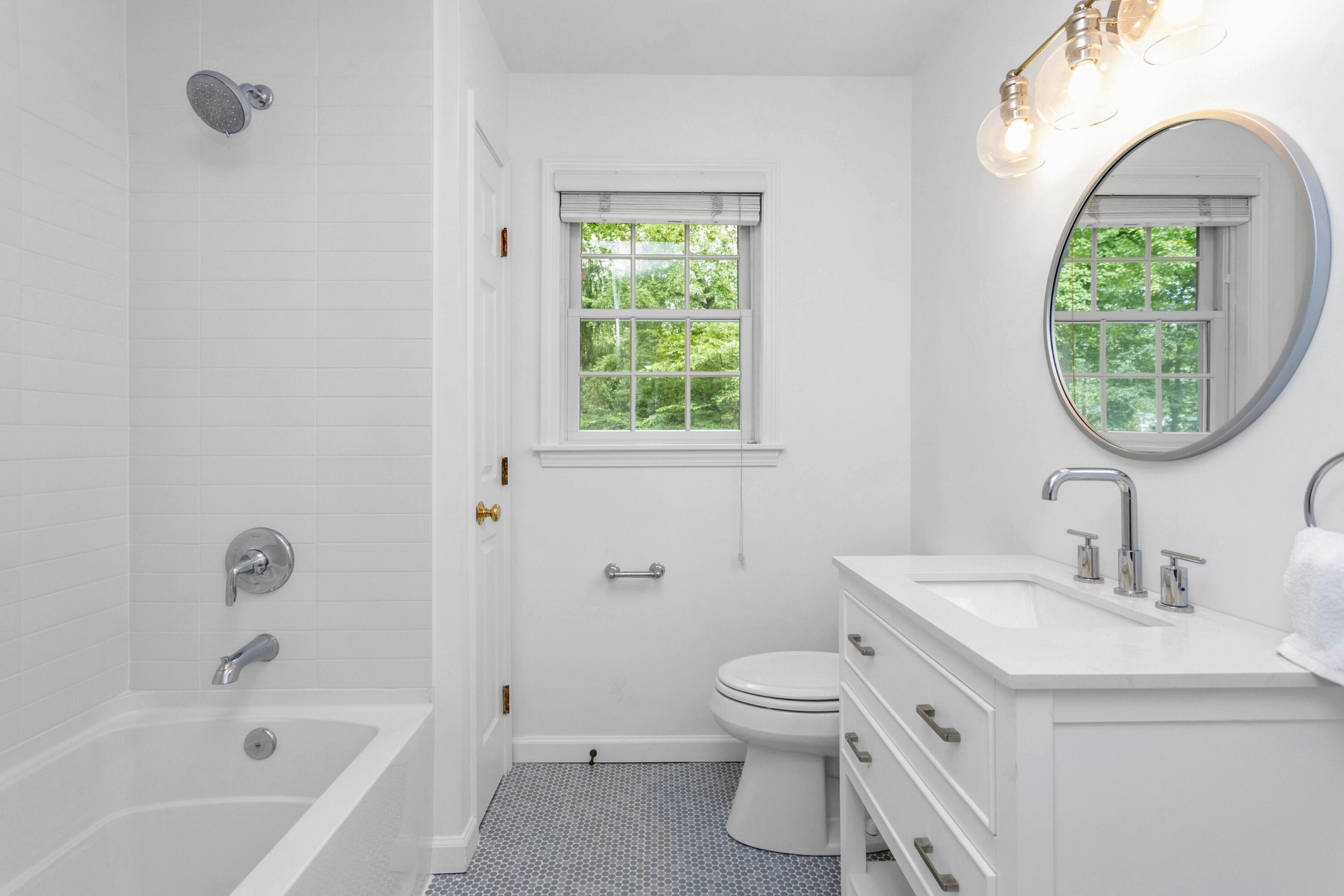 215 Leroy Avenue Darien, CT 06820 - Photo 27 of 34 a bathroom with a sink a toilet and a bathtub