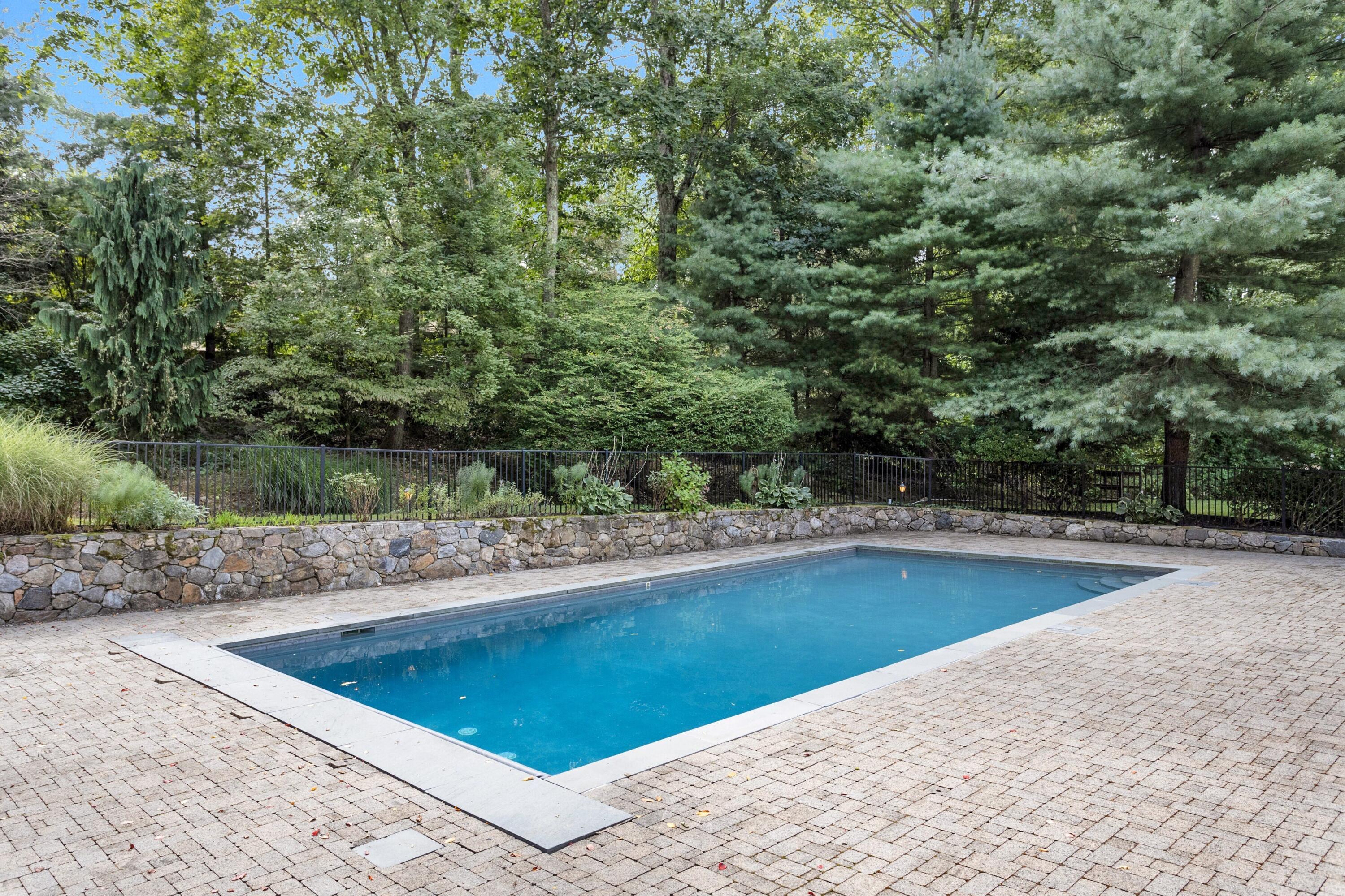 215 Leroy Avenue Darien, CT 06820 - Photo 29 of 34 a view of a swimming pool with an outdoor space