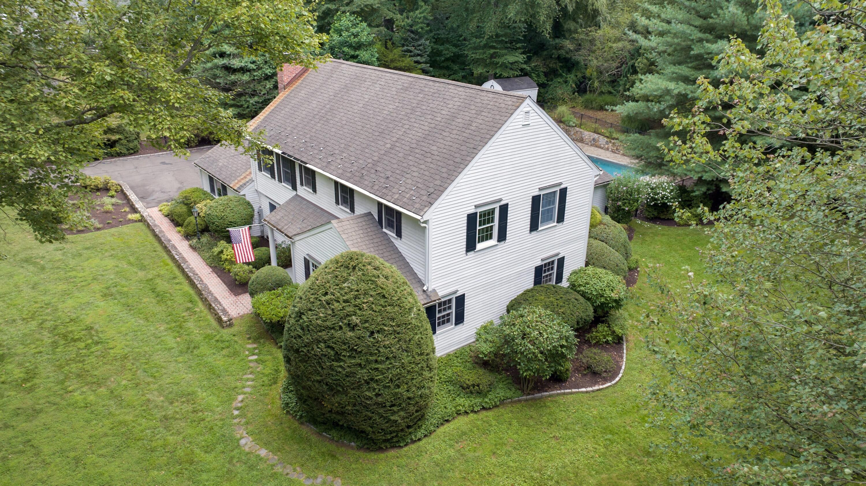 215 Leroy Avenue Darien, CT 06820 - Photo 4 of 34 a aerial view of a house with a yard and potted plants