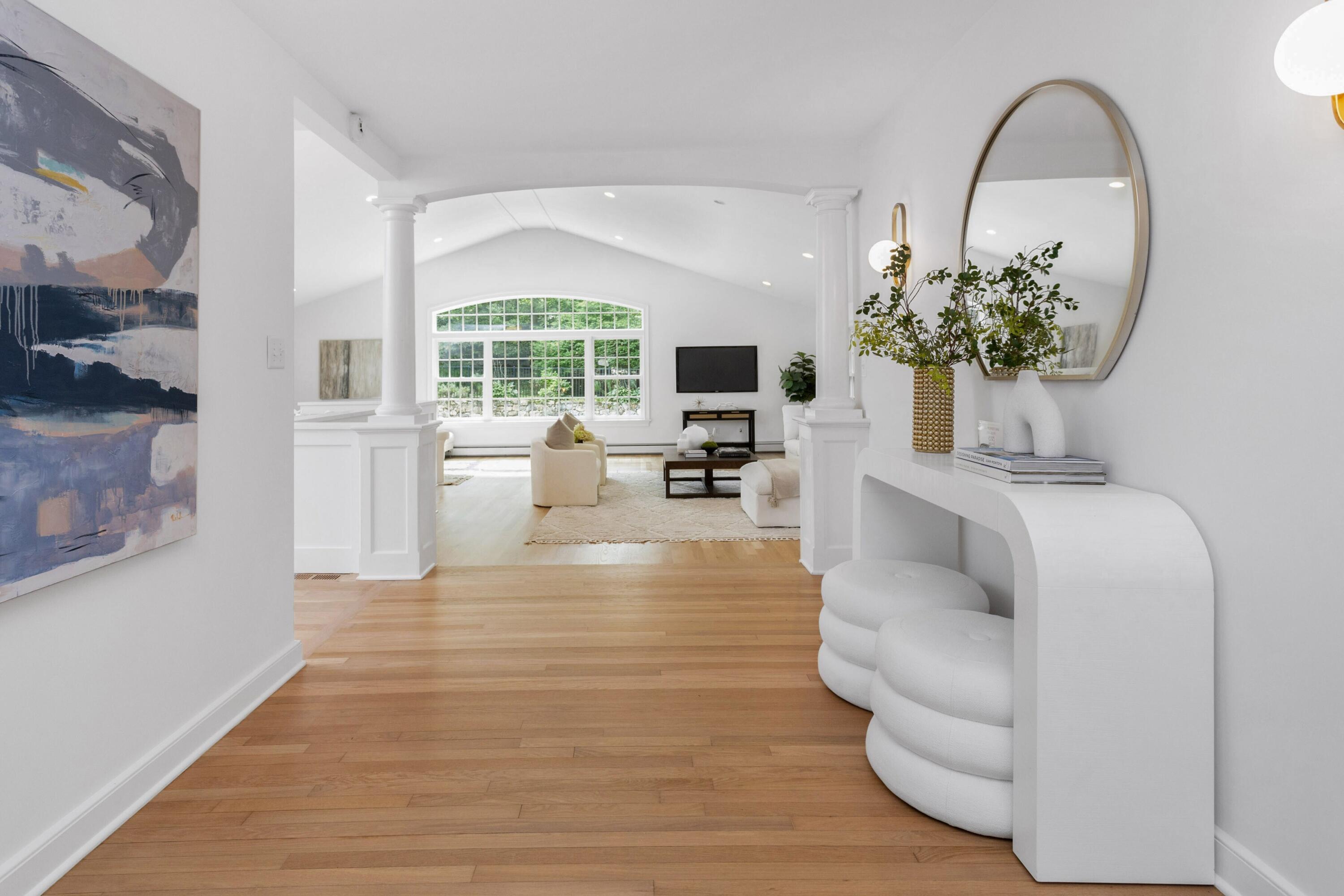 215 Leroy Avenue Darien, CT 06820 - Photo 7 of 34 a living room with fireplace furniture and a large window