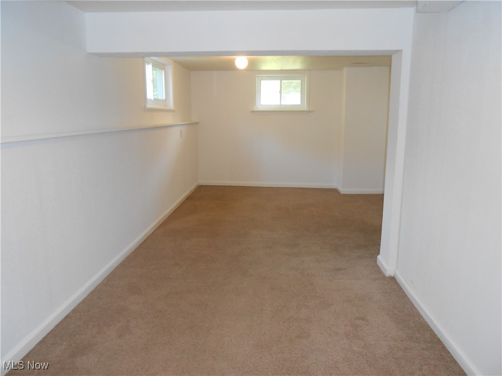 17022 Howe Road Strongsville, OH 44136 - Photo 21 of 22 Below grade area featuring light colored carpet and baseboards