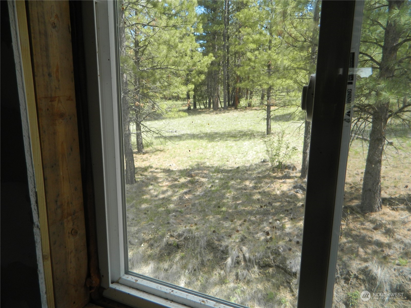 210 Main Road Tonasket, WA 98855 - Photo 17 of 39 a view of a room with a tree in it