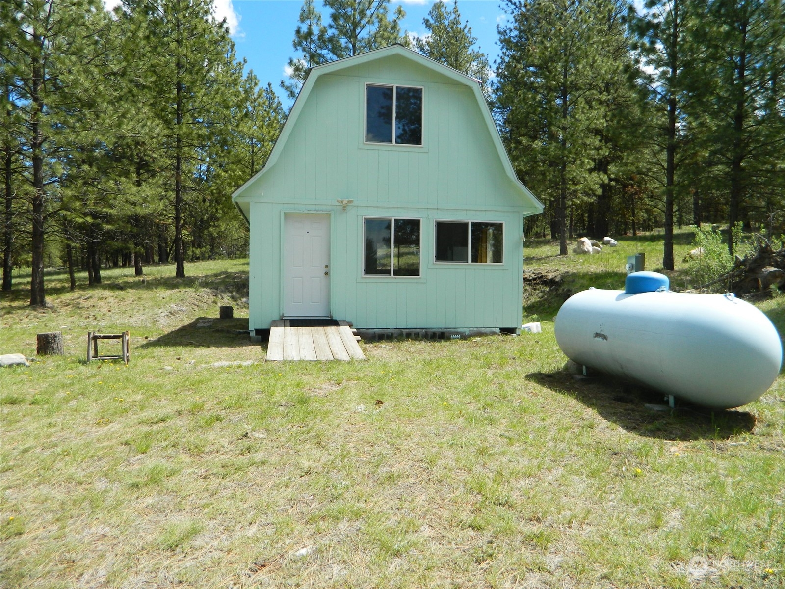 210 Main Road Tonasket, WA 98855 - Photo 3 of 39 a view of a house with backyard