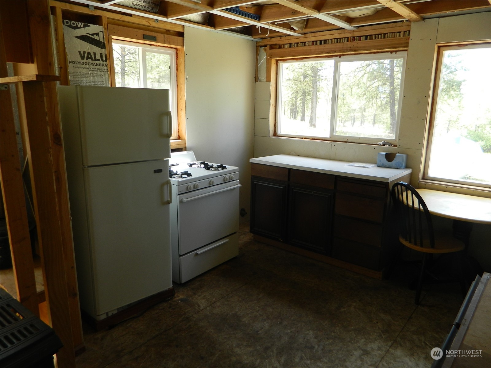210 Main Road Tonasket, WA 98855 - Photo 8 of 39 a room with window and refrigerator