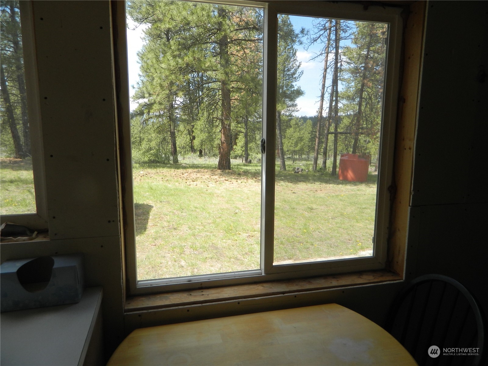 210 Main Road Tonasket, WA 98855 - Photo 10 of 39 a view of a room that has a bed in it