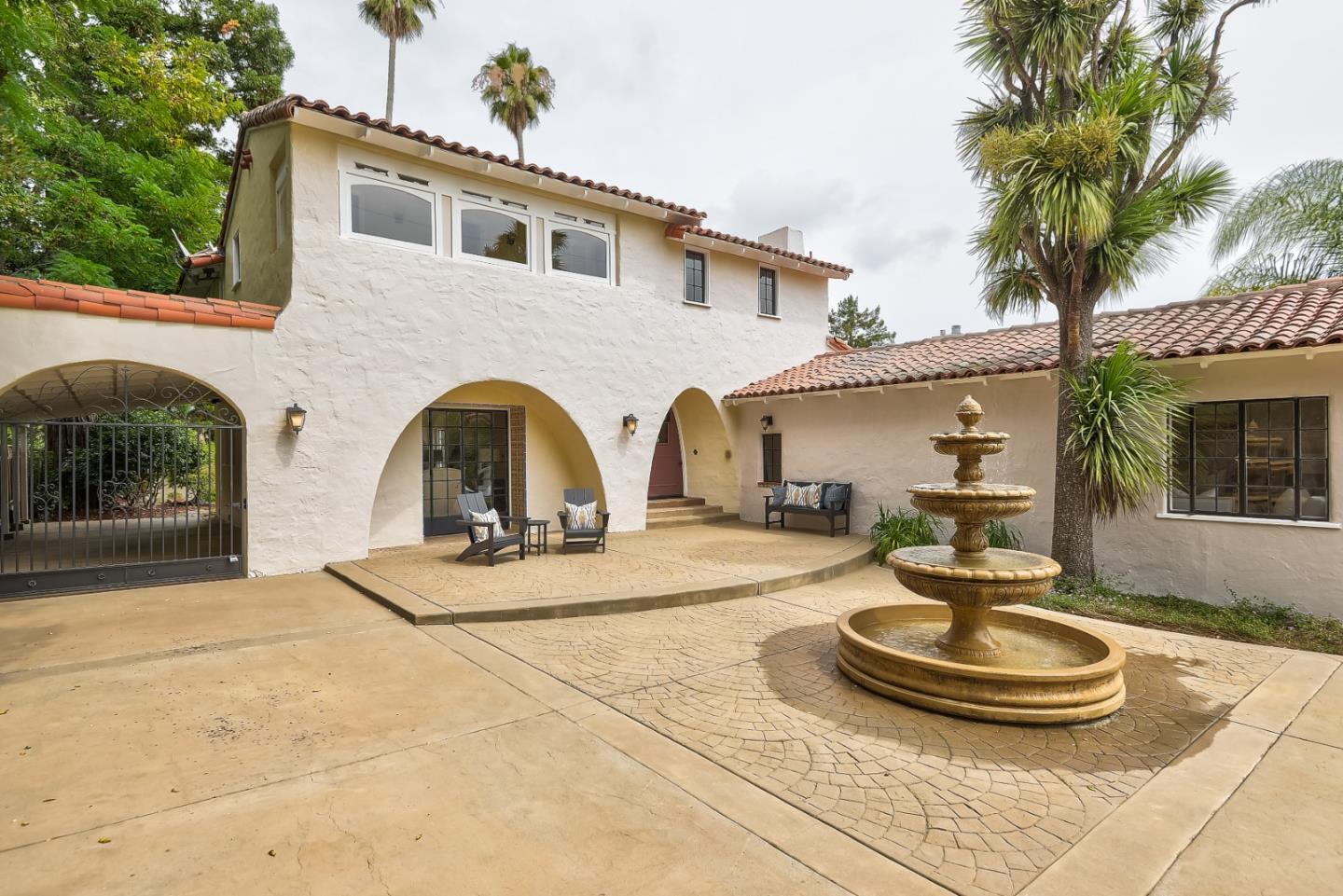 125 Alturas Drive Burlingame, CA 94010 - Photo 15 of 59 a front view of a house with a yard and potted plants