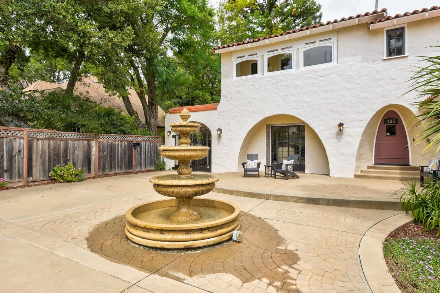 125 Alturas Drive Burlingame, CA 94010 - Photo 16 of 59 a front view of a house with garden having patio