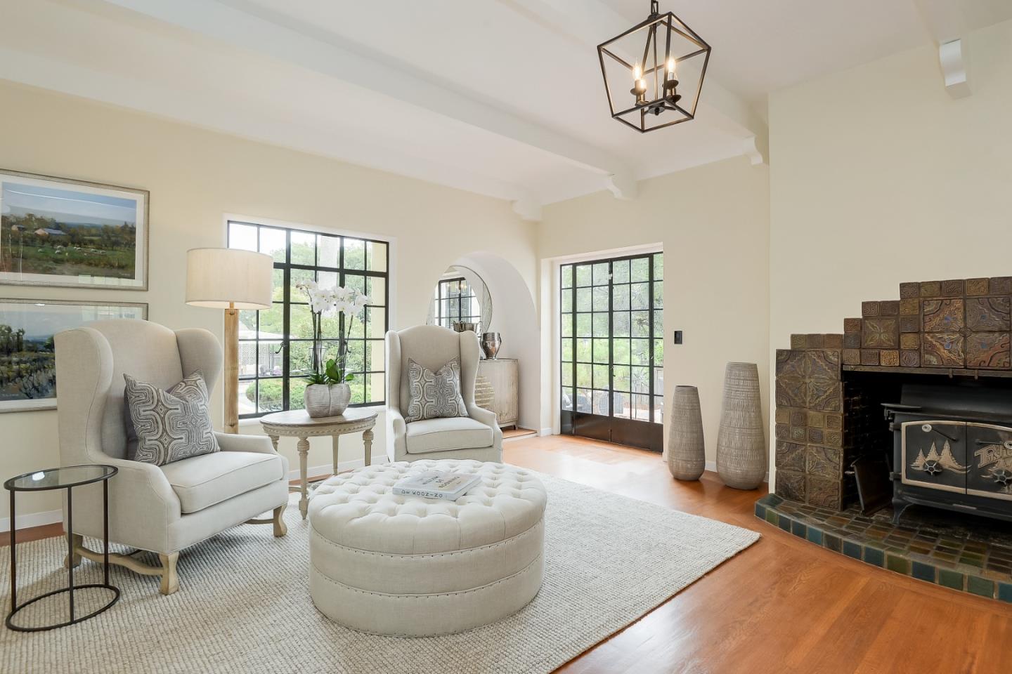 125 Alturas Drive Burlingame, CA 94010 - Photo 22 of 59 a living room with furniture a fireplace and a flat screen tv