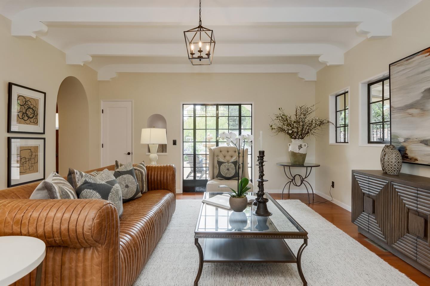125 Alturas Drive Burlingame, CA 94010 - Photo 25 of 59 a living room with furniture chandelier and a fireplace