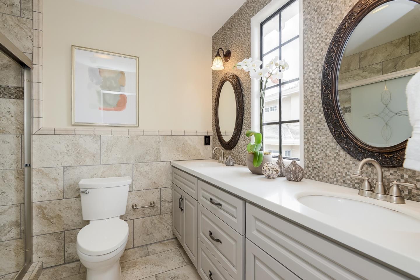 125 Alturas Drive Burlingame, CA 94010 - Photo 36 of 59 a bathroom with a double vanity sink mirror and toilet