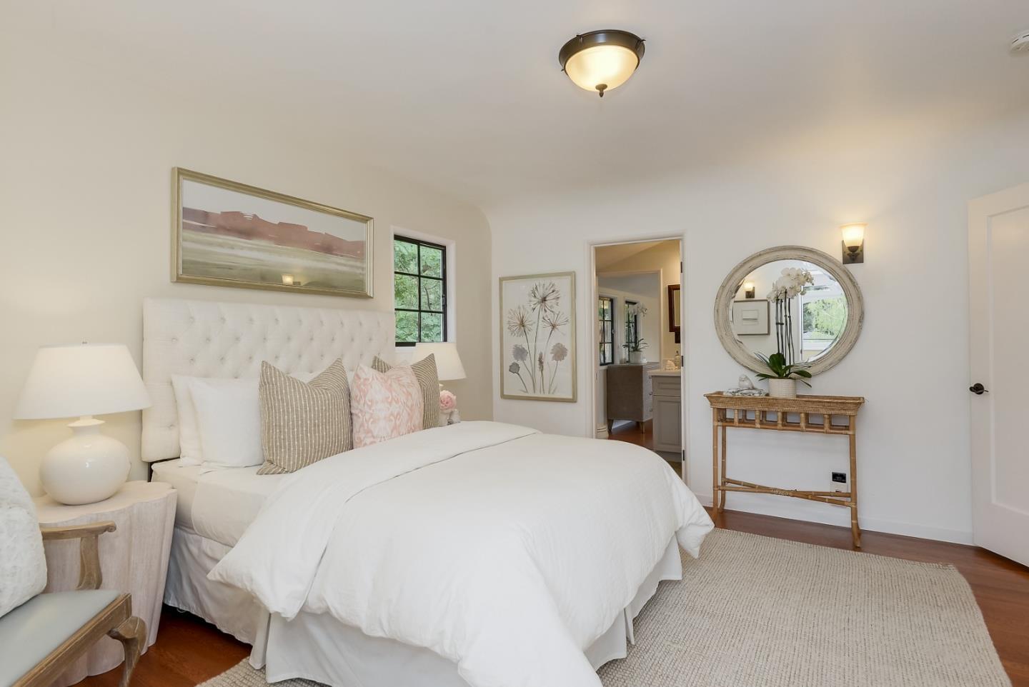 125 Alturas Drive Burlingame, CA 94010 - Photo 41 of 59 a bedroom with a bed and a chandelier