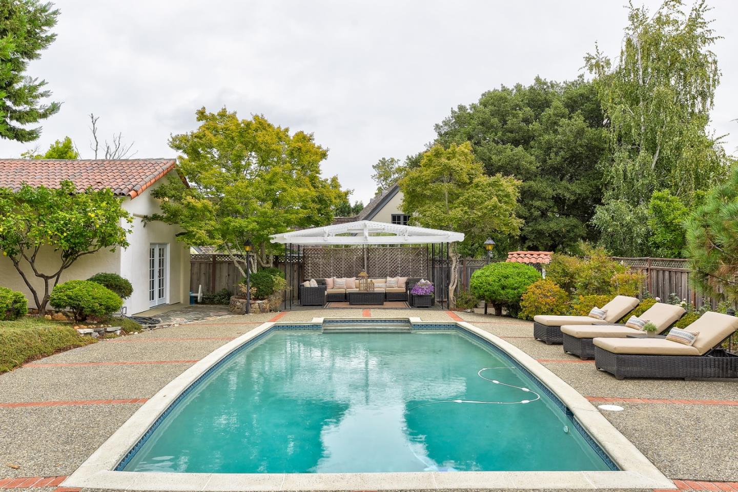 125 Alturas Drive Burlingame, CA 94010 - Photo 52 of 59 swimming pool view with a seating space and a garden view